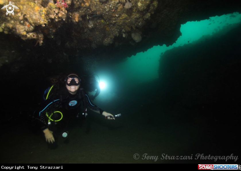 A Diver in a sea cave