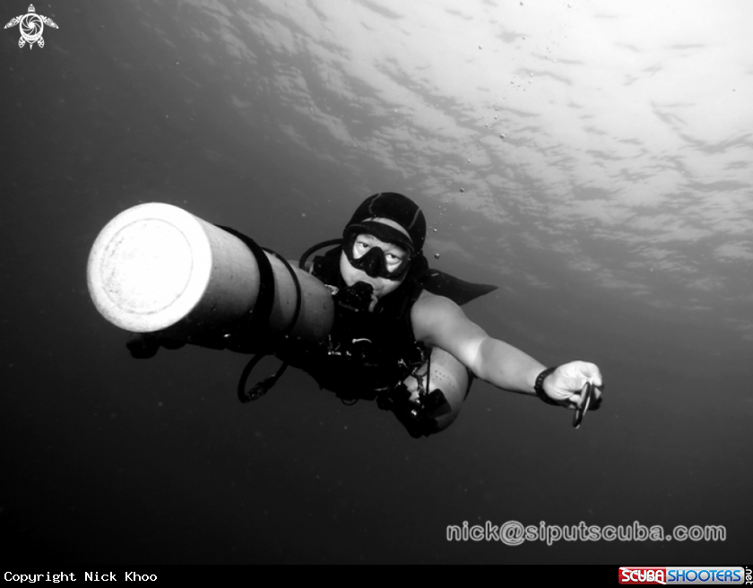 A sidemount diver