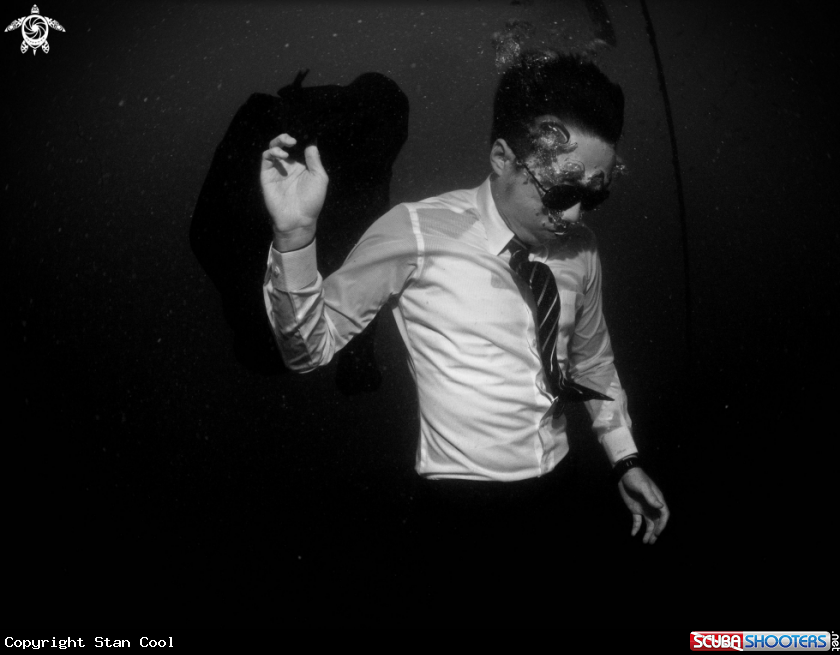 A Wet-suit man underwater