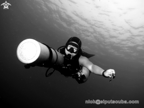 A sidemount diver