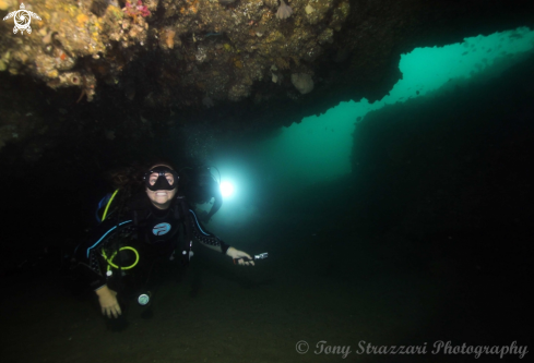 A Diver in a sea cave
